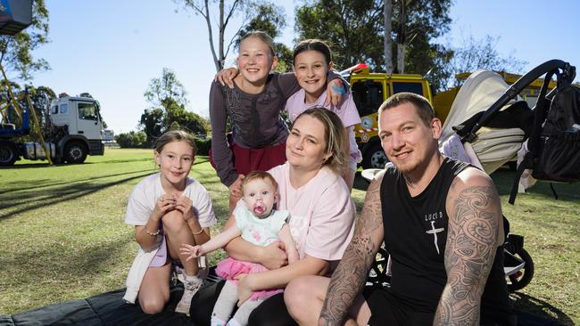 At Sadie's Day Out are (from left) Sophie Moore, baby Phoebie Dunn, Quinn Mesken and Rosalie Moore (standing), Stephenie Wicks and Dan Dunn. The event, a special celebration of the life of five-year-old crash victim Sadie, was held at Cambooya State School, Saturday, June 7, 2025. Picture: Kevin Farmer