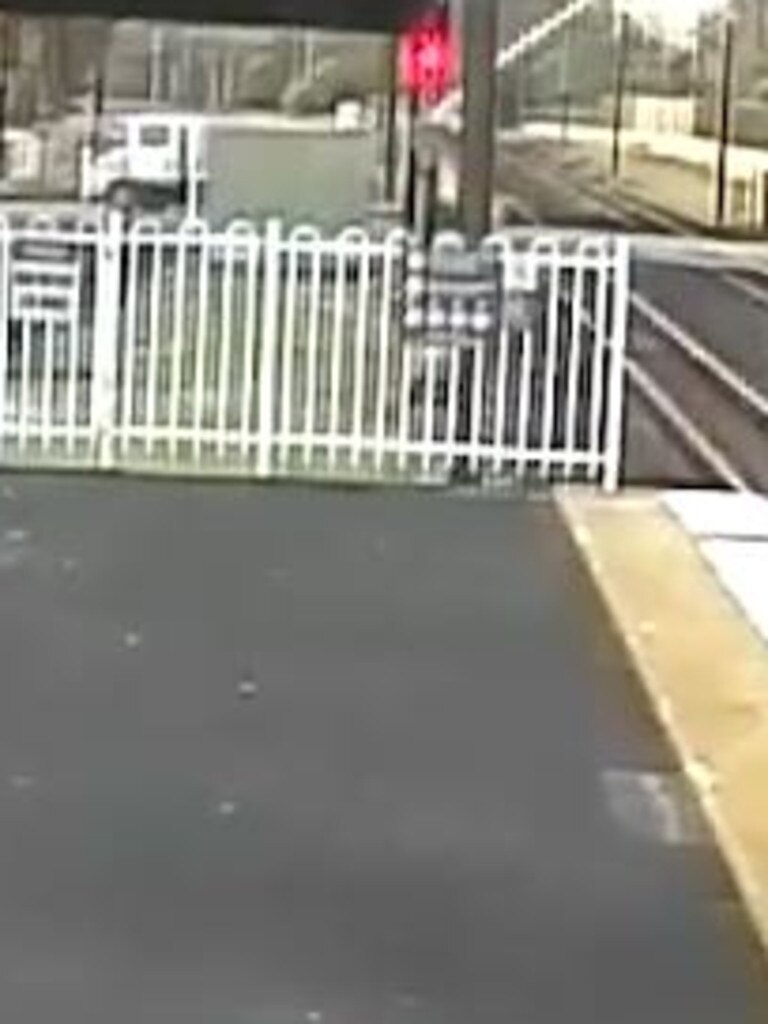 The moment a trailer hits power lines near Carseldine train station.