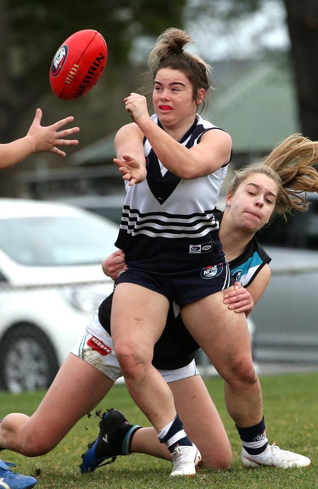 Chloe Moorcroft gets a handball away during Bundoora’s semi-final victory. Picture: Hamish Blair