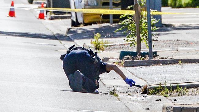 An officer searches for evidence along Dunorlan Road in Edwardstown, where the man was found. Picture: NCA NewsWire / Brenton Edwards