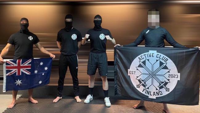 A National Socialist Network member poses with Active Club Finland on an exchange trip to the white power group in April. Picture: Supplied