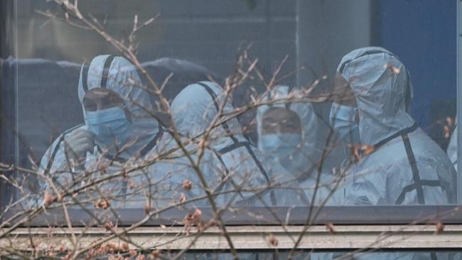 Members of the WHO team at the Hubei Centre for animal disease control and prevention in Wuhan last week. Picture: AFP