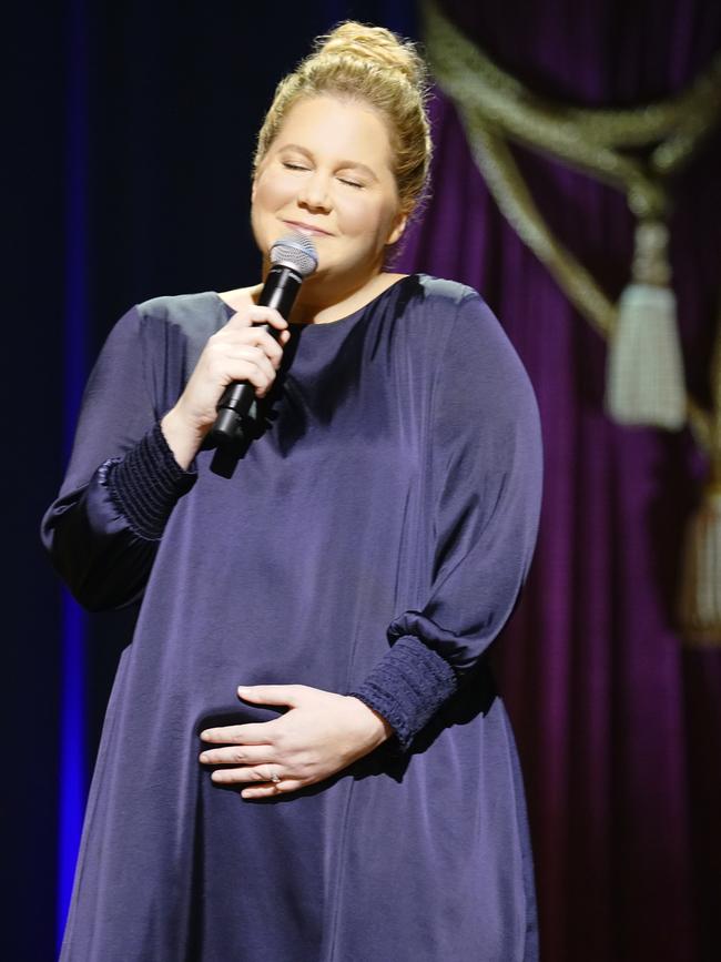 A pregnant Schumer onstage in 2018.