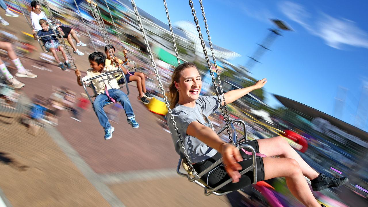 Kaisha James 21 enjoys a ride on the Wave Swinger on a perfect Autumn day. Picture: Toby Zerna