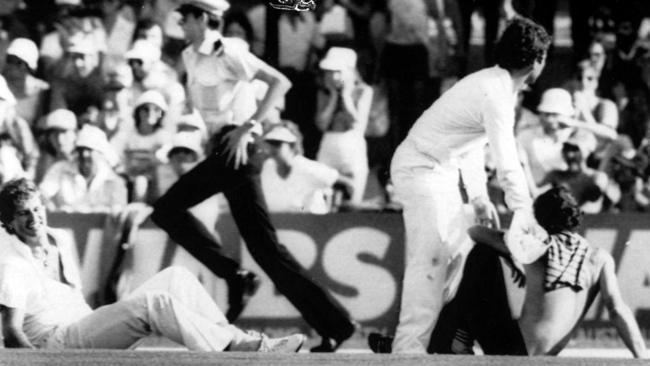 Terry Alderman grimaces in agony after dislocating his shoulder when tackling a pitch invader at the WACA in 1982.