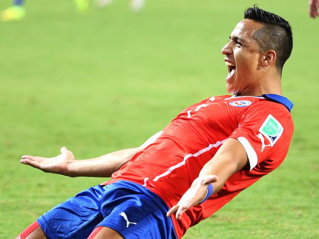 Alexis Sanchez of Chile scores the opener against Australia in their World Cup clash.