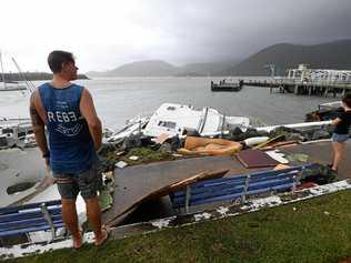 Locals inspect damage at Shute Harbour, Airlie Beach, after Cyclone Debbie's onslaught. Picture: DAN PELED