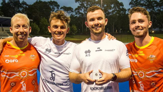 Townsville junior Mitch Nicholson (holding pin) with Queensland players Corey Weyer, Tim Howard, and Jayden Atkinson. Picture: Andrew Wiseman (Instagram: @wisemansport).