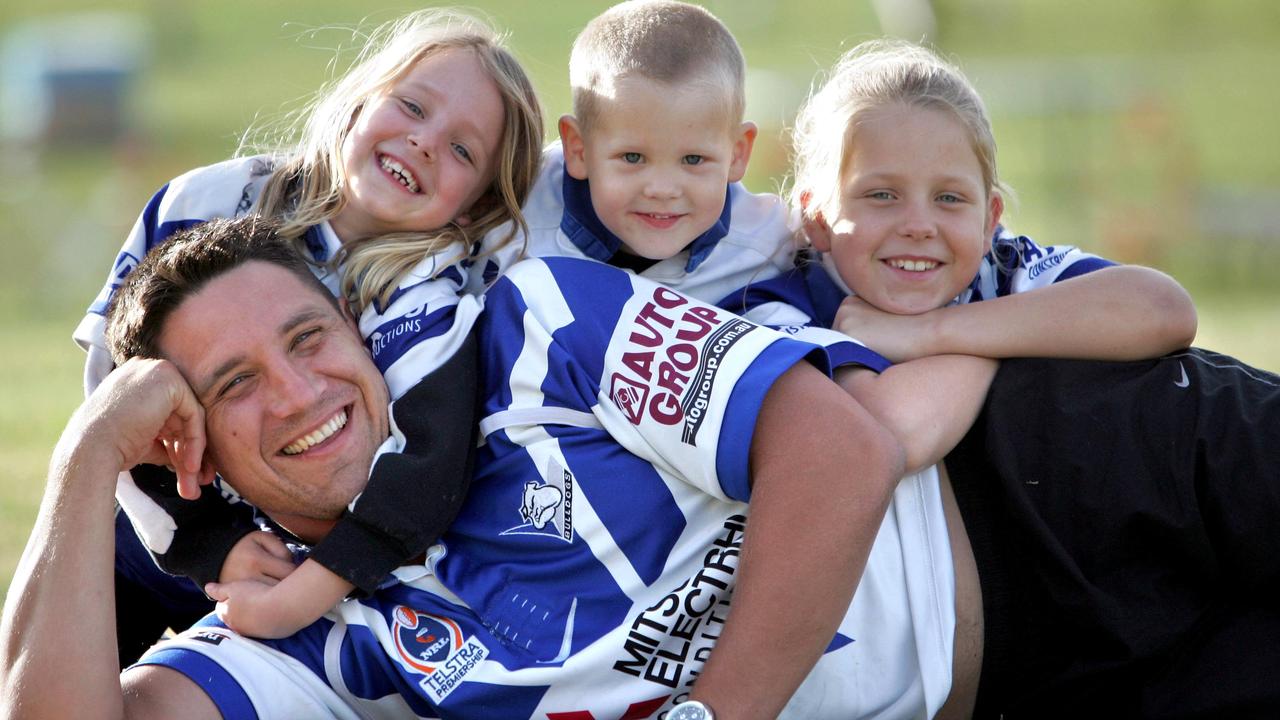 Bulldogs legend Steve Price with children Kassey, Riley and Jamie in 2004. Riley Price will make his NRL debut this weekend — against the Bulldogs.