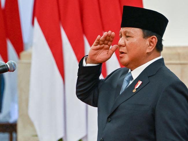 Indonesia's President Prabowo Subianto presides over the swearing-in ceremony of his cabinet ministers at the Presidential Palace in Jakarta on October 21, 2024. Newly inaugurated Indonesian President Prabowo Subianto on October 21 swore in his new cabinet, which includes key members of his predecessor's team and suggests he will continue his main policies, analysts said. (Photo by BAY ISMOYO / AFP)