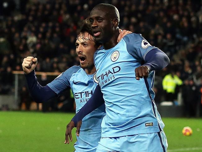 Yaya Toure of Manchester City celebrates scoring the opening goal with David Silva.