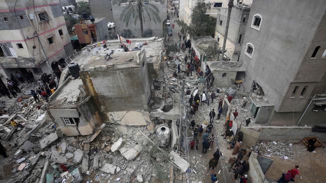 People search for victims in the rubble of a family home in Deir al-Balah, in the central Gaza Strip, after it was recently hit in an Israeli air strike. Picture: AFP