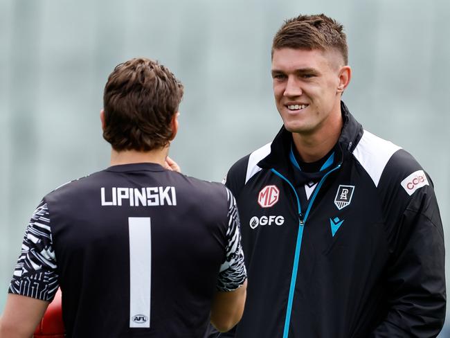 MELBOURNE, AUSTRALIA - APRIL 20: Patrick Lipinski of the Magpies and Jordon Sweet of the Power are seen before the 2024 AFL Round 06 match between the Collingwood Magpies and the Port Adelaide Power at the Melbourne Cricket Ground on April 20, 2024 in Melbourne, Australia. (Photo by Dylan Burns/AFL Photos via Getty Images)