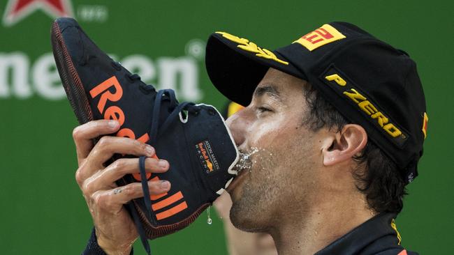 Daniel Ricciardo drinks champagne out of his shoe after winning the Formula One Chinese Grand Prix in Shanghai. Picture: AFP.