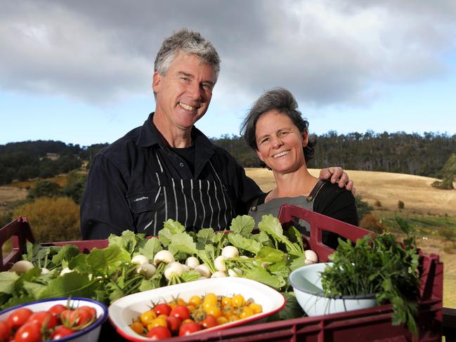 Above<b>:</b> Gourmet Farmer Matthew Evans with partner, Sadie, holding some of the fresh produce from their farmer’s garden. Picture: LUKE BOWDEN