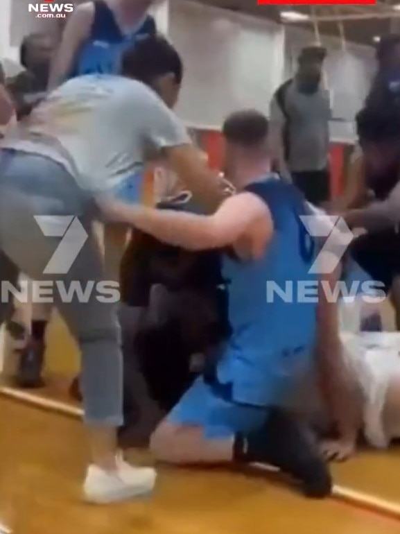 A player in a blue singlet attempts to intervene. Pictures 7NEWS