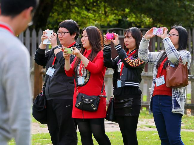 SUN TAS: PORT ARTHUR: Tourists taking photos on their phones and cameras at the Port Arthur Historic Site