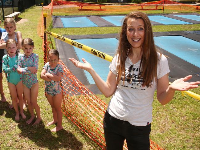 Kathy Landos is bemused by an insurance bungle that has closed Lorne Trampolines, as are holidaying kids Olivia, 10, Lachie, 8, Samara, 11, Tahlia, 6, Evie, 7, and Ebony, 5. Picture: Alison Wynd