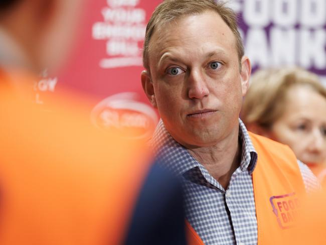 Premier Steven Miles addresses the media at Foodbanks warehouse facility at Morningside on Sunday morning. Picture Lachie Millard