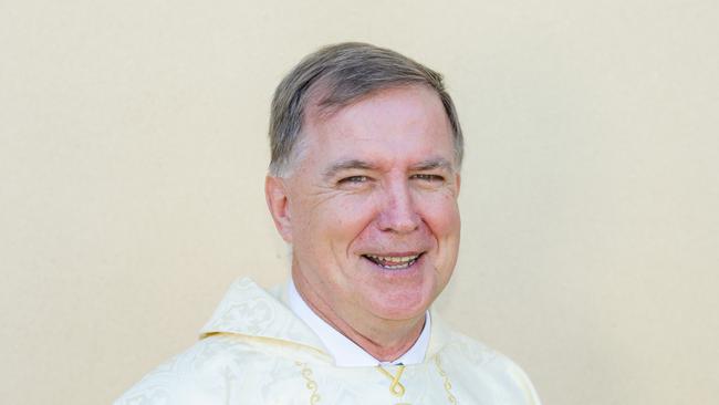 Father Mick Lowcock has been named a Queensland Great.