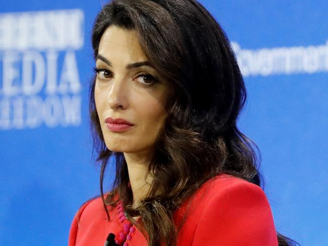 (FILES) In this file photo taken on July 10, 2019, Lebanese-British human-rights lawyer Amal Clooney takes part in a panel discussion at the Global Conference for Media Freedom in London. - Clooney quit as Britain's special envoy on media freedom in protest at the Government's  decision to reverse the agreement on leaving the Union European. (Photo by Tolga AKMEN / AFP)