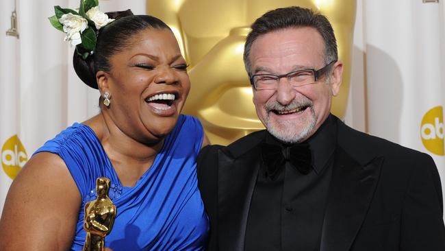 Proud moment ... Mo'nique celebrated her Oscar win in 2010 with Robin Williams, who died last year. Picture: AFP