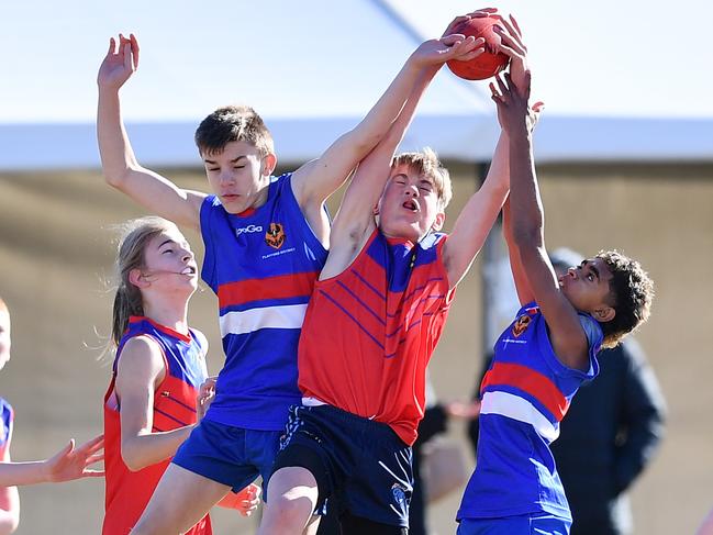 Action between Playford (Blue) and Torrens River (Red) during the Year 7 SAPSASA Metro Football Carnival at West Beach Wednesday June 23,2021.Picture Mark Brake