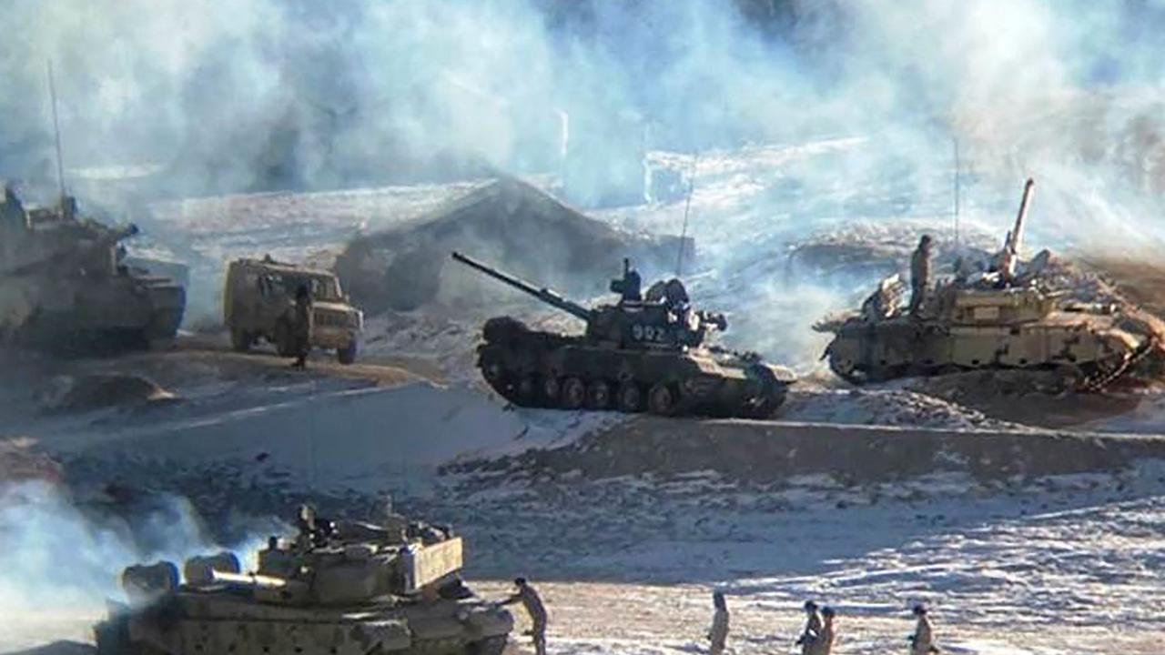 A photograph released by the Indian Army on February 16, 2021 which shows People Liberation Army (PLA) soldiers and tanks during military disengagement along the Line of Actual Control (LAC) at the India-China border in Ladakh. (Photo by – / INDIAN MINISTRY OF DEFENCE / AFP)