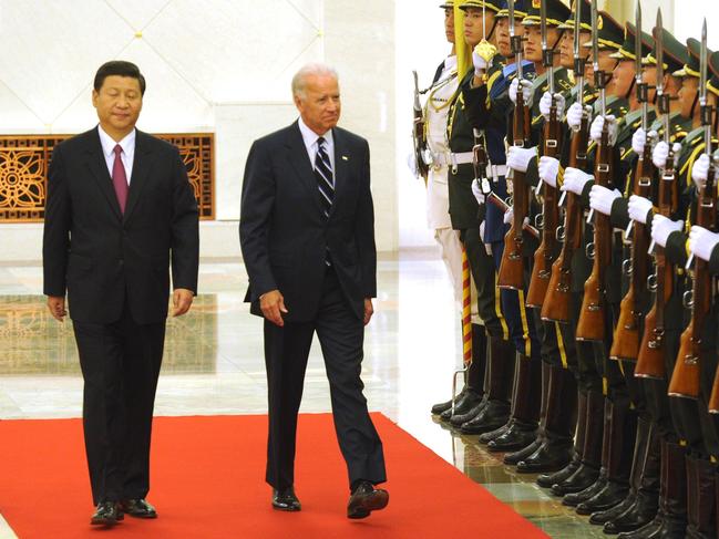 Chinese Vice President Xi Jinping escorts then US Vice President Joe Biden down the red carpet past Chinese honour guards during a welcome ceremony at the Great Hall of the People in Beijing, China.