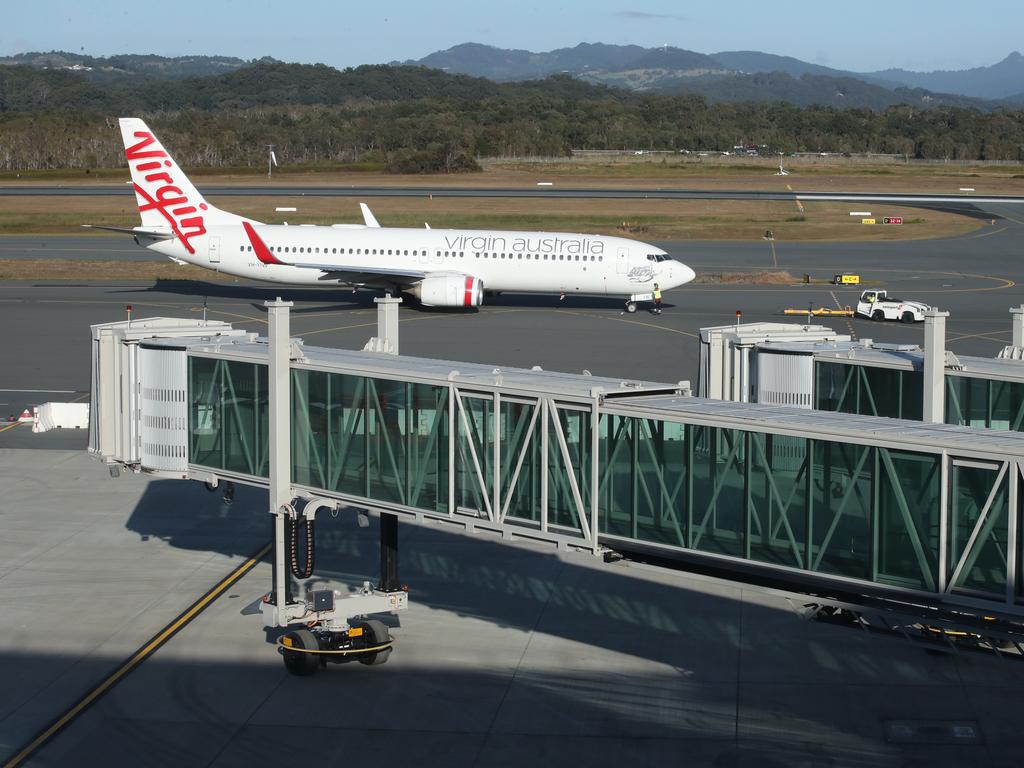 New aerobridges stretch out from the new terminal. Picture: Glenn Hampson.