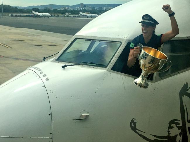 Adelaide posted this image on their Twitter account in 2017 of Randall returning to Adelaide with the inaugural AFLW premiership cup. Picture: Adelaide Football Club/Twitter