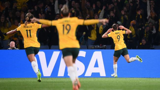 Caitlin Foord celebrates scoring her team's first goal against Denmark