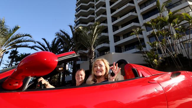 Craig Trinder and partner Helena Horsley with their Ferrari 360 F Spider car and Aprila RSV4 Factory motorcycle which they including with the sale of their penthouse. Gold Coast. Photo: Regi Varghese