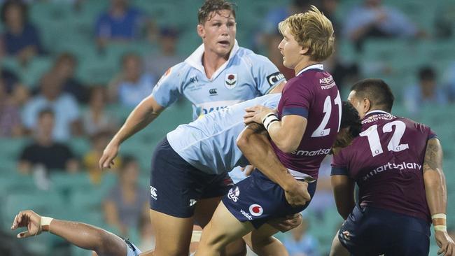 Israel Folau knocks Tate McDermott with a heavy tackle. Picture: AAP Image/Craig Golding