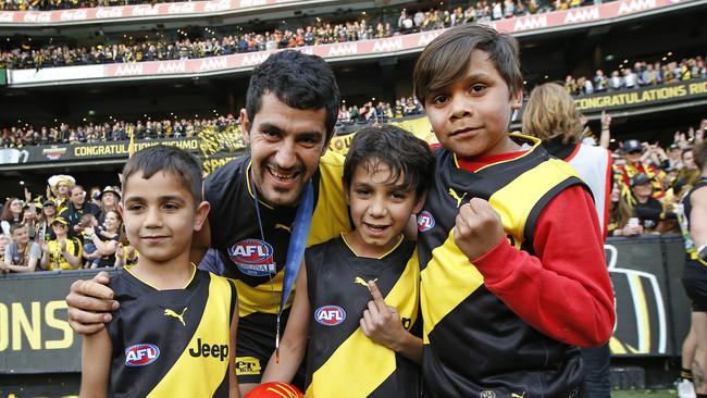 Marlion Pickett with three of his children after the grand final. Pic: David Caird