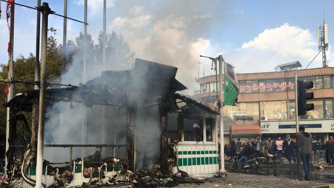 A police station set ablaze by protesters during a demonstration against a rise in petrol prices in the central city of Isfahan on November 17. Picture: AFP