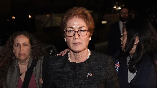 Former US Ambassador to Ukraine Marie Yovanovitch (C) flanked by lawyers, aides and Capitol police, leaves the US Capitol after testifying behind closed doors. Picture: AFP)