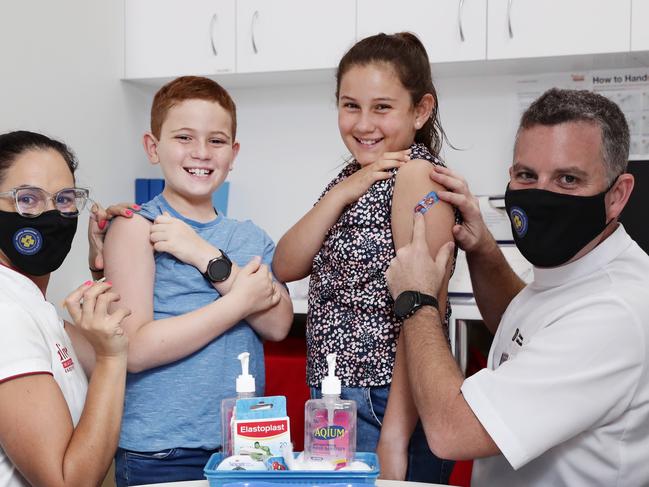 The Pharmacy Guild of Australia has launched their National Childhood Vaccination Program for children aged 5 to 11 years, with National President Trent Twomey vaccinating to children on Sunday morning. Qualified Covid-19 vaccinator and pharmacist Georgina Twomey with her son Archer Twomey, 8, daughter Scarlett Twomey, 10 and Trent Twomey at their Alive pharmacy in Westcourt. Picture: Brendan Radke