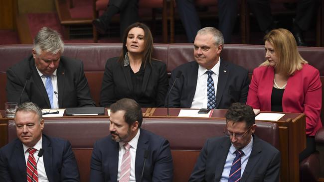 Senator Jacqui Lambie (centre) sits with Centre Alliance Senators Rex Patrick (left), Stirling Griff and Centre Alliance MP Rebekah Sharkie during the official opening of the 46th federal parliament in the Senate chamber at Parliament House in Canberra, Tuesday, July 02, 2019. AAP Image/Lukas Coch