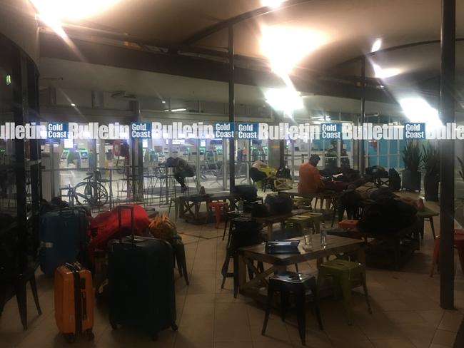 Stranded travellers sleep outside Gold Coast Airport. Photo: Jay Gadhavi