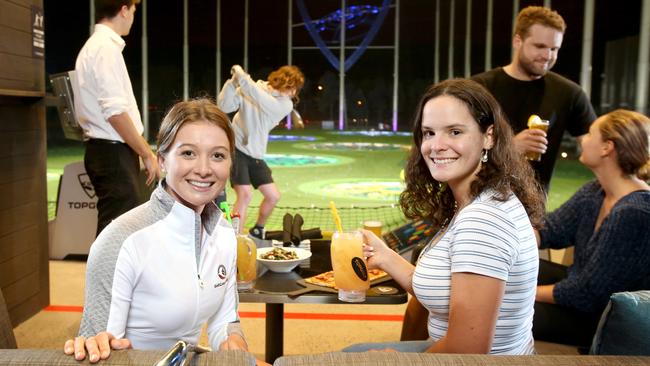 L to R, (front) Becky Kay top amateur golfer, with Brittany Wheatley from Bilambil, (back) Adam Kay from Elanora, and Elijah Arnold from Pottsville, Ryan Dooley from Bilambil, with Jade Wheatley from Bilambil, at Top Golf. (AAP Image/Steve Pohlner)