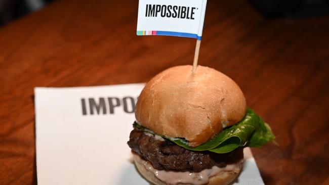 The Impossible Burger 2.0, the new and improved version of the company's plant-based vegan burger that is marketed to “taste like real beef” is introduced at a press event in January, 2019. Proponents call it "slaughter-free," or "clean" meat. For many in the traditional meat industry, it is simply "fake." (Photo by Robyn Beck / AFP)