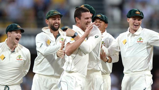 Australian paceman Josh Hazlewood (centre) celebrates with teammates after he took the wicket of Pakistan’s Younis Khan on Friday night.