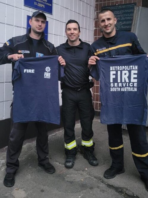 Andy Dunt, middle, at the Kharkiv Fire Station where he is based.