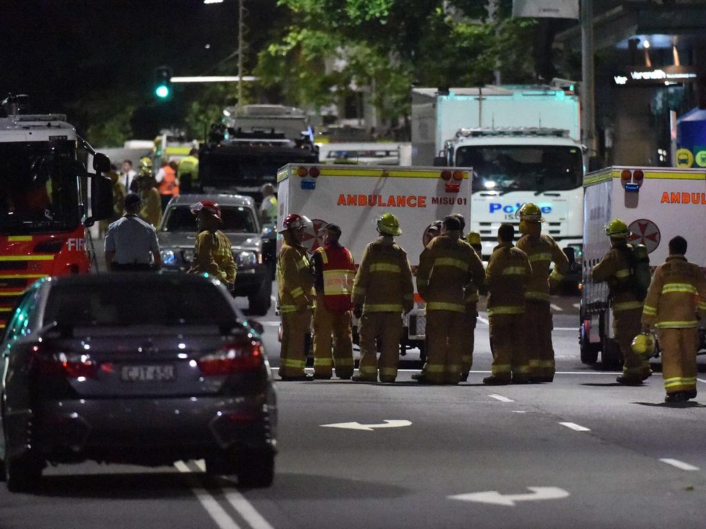 Fire fighters and paramedics wait ready for action near the scene of the Lindt cafe siege. Picture: William West (AFP)