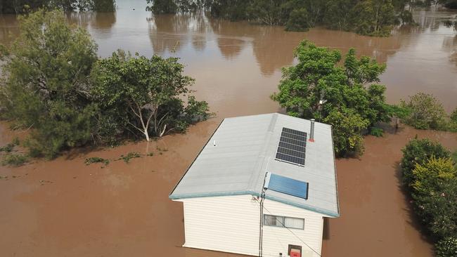 A house is seen surrounded by flood waters from the Mary River in the town of Tiaro, 198km north of Brisbane as wild weekend weather takes its toll Picture: AAP