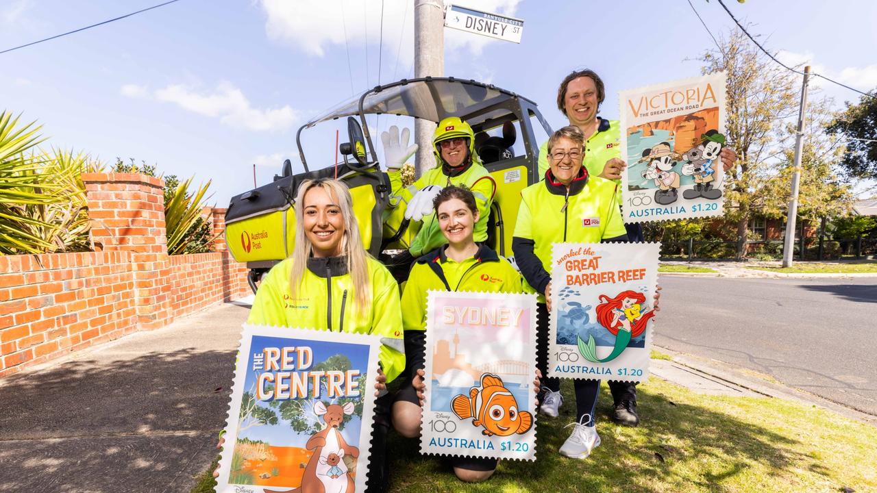 Australia Post workers with Disney’s limited stamp collection. Picture: Supplied