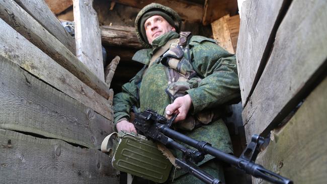 serviceman of the Donetsk People's Militia on the front line near the rural town of Staromikhailovka, west of Donetsk. Picture: Getty Images)