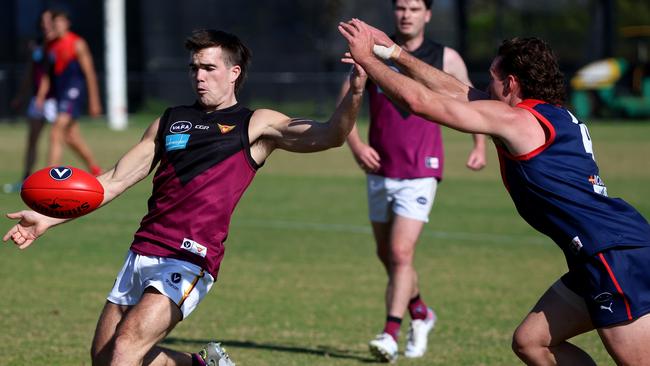 Old Haileybury’s Joshua Gasparini snaps. Picture: Hamish Blair