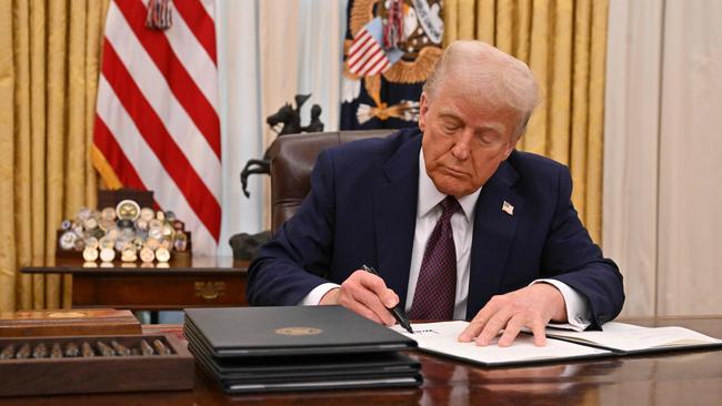 US President Donald Trump signs an executive order to declassify files of former President John F. Kennedy, former Attorney General Robert F. Kennedy and civil rights leader Martin Luther King Jr..